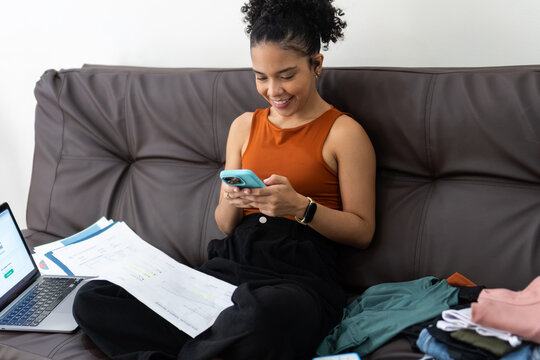 Young woman multitasking remote work and personal tasks