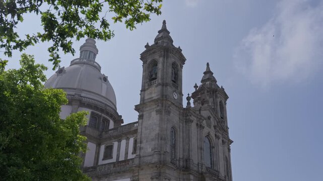 Stone Bell Towers And White Dome Of Sameiro Sanctuary Rising Above Trees In Braga