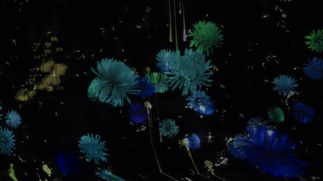 Glowing blue and green digital flowers blooming across a black projection wall
