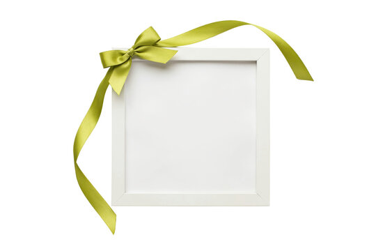 Square white frame decorated with a lime green satin ribbon bow isolated on a transparent background