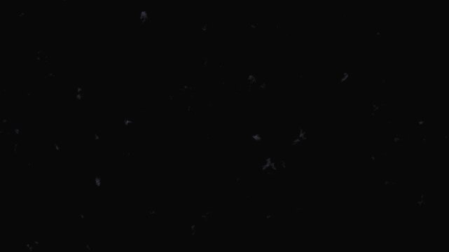 Cosmic dust particles drift in deep space nebula with subtle light flares during stellar formation