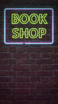Vertical Neon Book Shop Sign Flickering on Dark Brick Wall