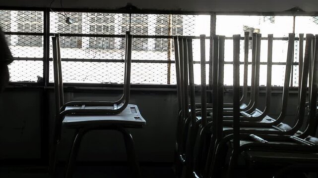 Inmate Stacking Chairs And Organizing Classroom In Penal Facility - 4K
