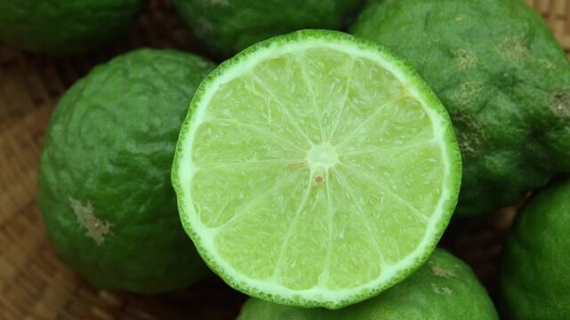 Fresh kaffir limes in a basket.
