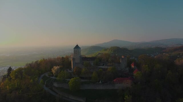 4K Drone Right-to-Left Orbit Flight Over Historic Starkenburg Fortress in Sunset Afterglow