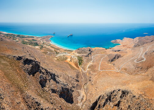 Xerokambos coastline and winding mountain road aerial view, Crete, Greece