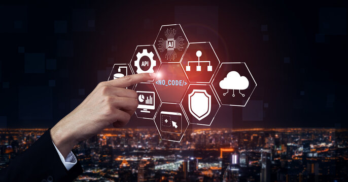 Hand Interacting with No Code Technology Icons Against Urban Night Cityscape Background Representing Digital Transformation and Innovation Quark.