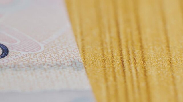 Close up of Mexican peso banknote showing Banco de Mexico text, intricate security patterns, printed details and colorful currency design used for financial transactions