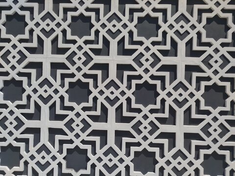 Intricate geometric Islamic pattern with symmetrical star motifs
