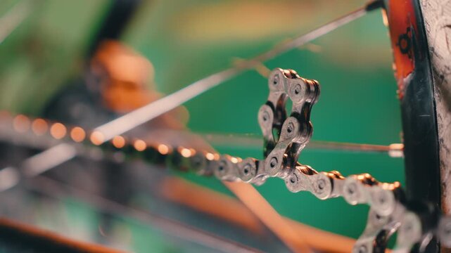 Macro Slow Motion: Twisted Bicycle Chain Link with Colorful Cinematic Lighting | Orbiting Camera Around Bent Metal Chain Detail | Bike Repair Close-Up Shot