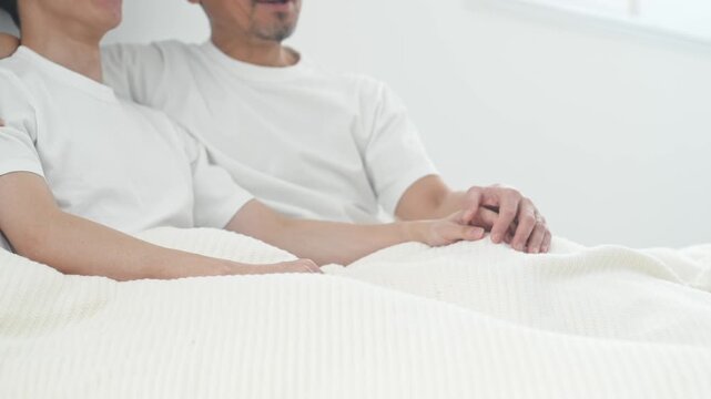 Two men snuggling in bed. Homosexuality, LGBT, romance, lovers, partners, couple, gay, same-sex marriage, gender identity.
