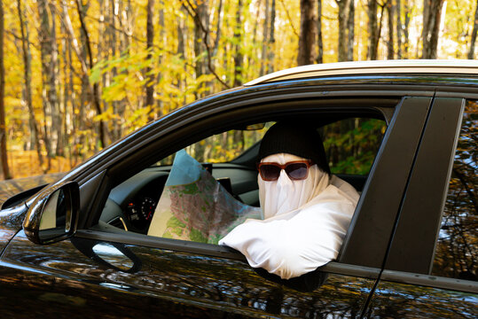 Humorous travel and navigation concept featuring ghostly character attempting to find the correct route during road journey, symbolizing uncertainty exploration adventure and decision making. Seasonal