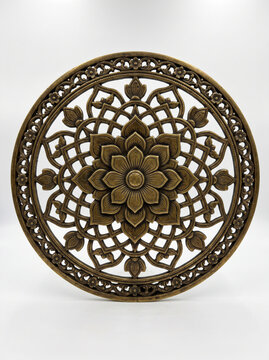 Circular floral jaali panel with radial petals and intricate antique brass South Indian temple ornamentation