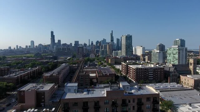 Aerial view of chicago skyline downtown buildings with elevated rail tracks.