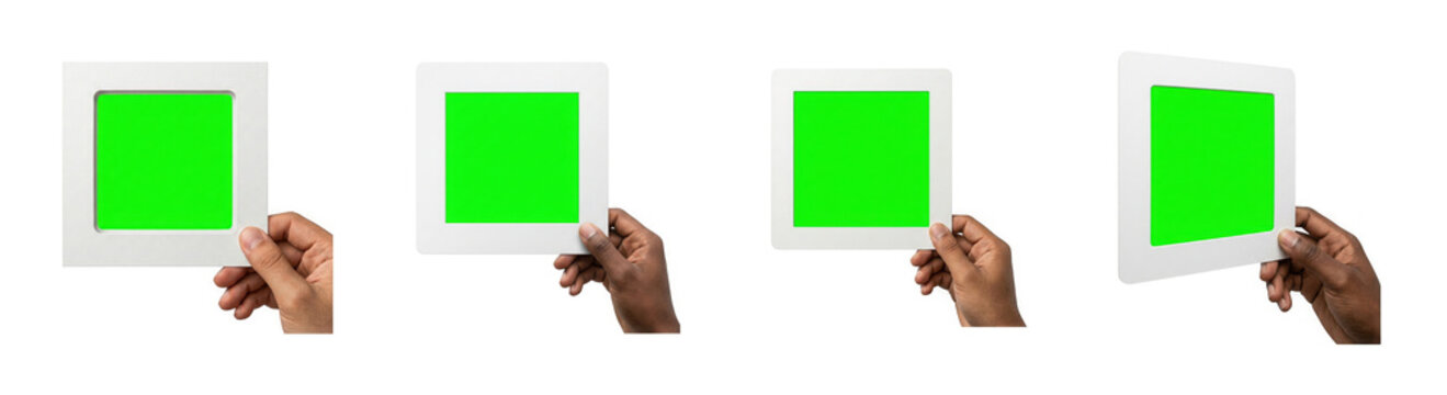 Hands holding square white picture frame with green screen chroma key on transparent background.