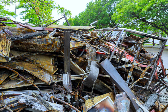 Large pile of scrap metal, debris sits in storm area after heavy hurricane