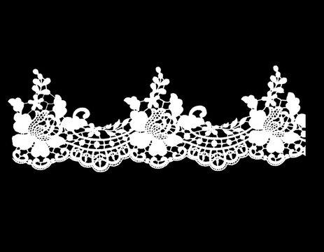 Elegant white floral lace trim pattern on a solid black backdrop.