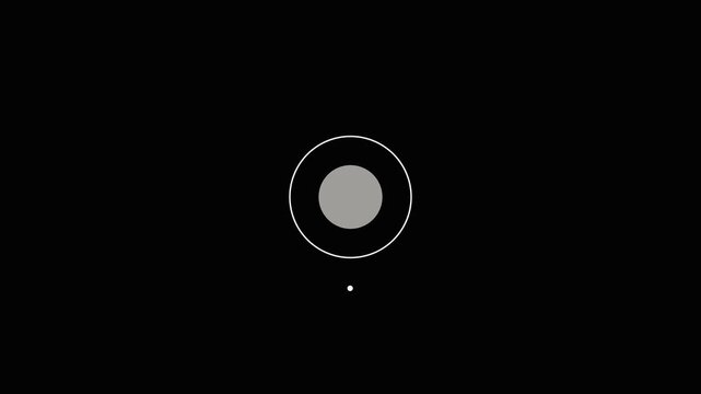 A minimalist abstract on a black background featuring a central grey circle surrounded by a thin white ring and a small white dot to the right suggesting.