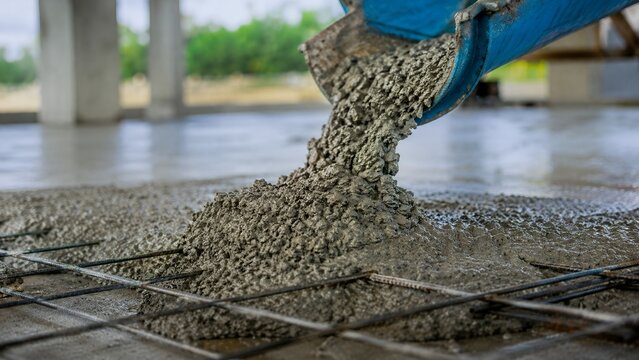 Concrete Pouring on Reinforced Foundation Slab at Construction Site, Building and Civil Engineering Concept