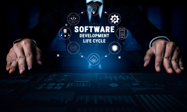Professional Hands Gesturing Over Digital Screen Illustrating Software Development Life Cycle with Icons Representing Various Stages and Elements Quark.