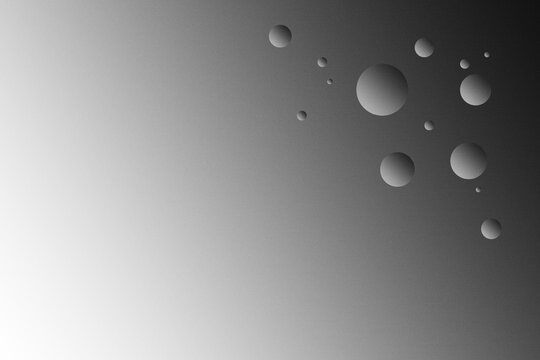 Monochrome grainy gradient background with abstract floating spheres for design modern minimalist black and white texture with floating 3d orb shapes looks like water drops, copy space