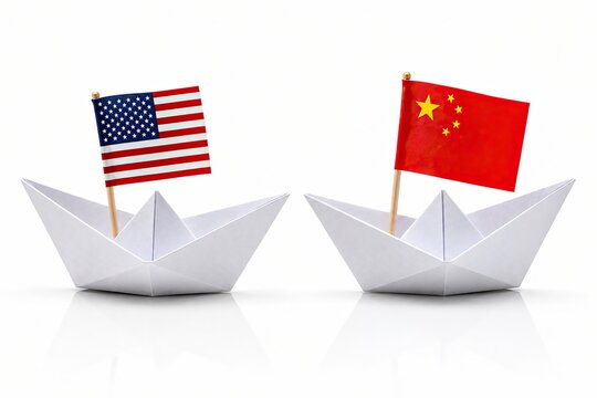 Two paper boats with american and chinese flags on white background