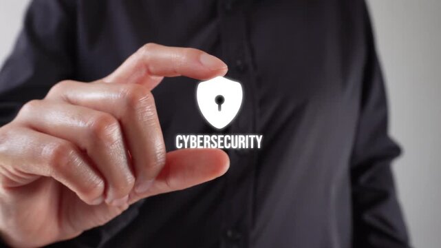 Close-up of a woman's hands holding a cybersecurity animation between two fingers