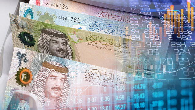 Bahrain currency and Middle East financial market analysis concept. Bahraini dinar banknotes overlaying digital stock market financial chart graph data and exchange trading index numbers.