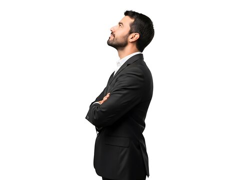 A profile view of a professional man in a suit looking up with confidence