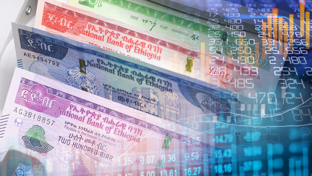 Ethiopian birr currency and East African financial market analysis concept. Ethiopian birr banknotes from National Bank of Ethiopia overlaying digital stock market financial chart graph data 