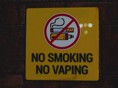 No smoking and no vaping yellow warning sign