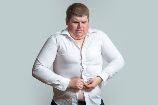 Overweight man buttons tight shirt. Big overweight body issue. Overweight belly needs diet. Male overweight concept isolated.