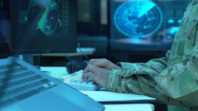engineer analyzing flight data and radar interface in airport control tower.