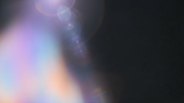 Abstract light leak overlay with lens flare and bokeh on black background