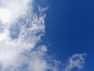 Obraz premium Air clouds in the blue sky background. Panorama sky with cloud on a sunny day