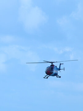 Civilian Helicopter Flying Through Blue Sky at Pacific Airshow Gold Coast