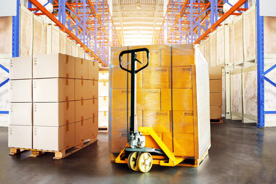 Forklift Pallet Truck in Warehouse. Bulk of Package Boxes Shipment on Tall Shelves Storage Warehouse. Cartons, Cardboard Boxes. Supply Chain, Supplies Goods Shipment. Warehouse Shipping	
