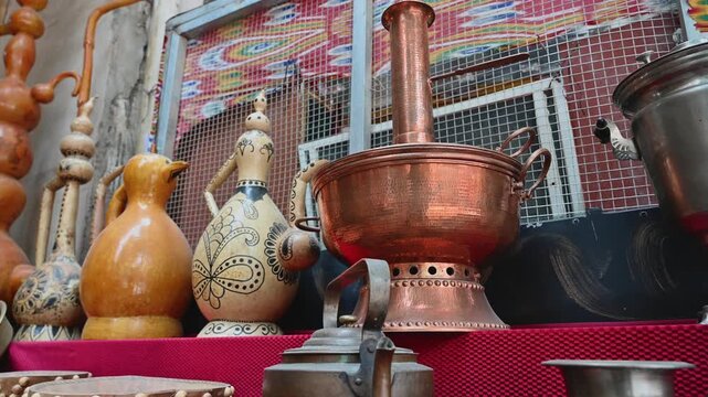 Traditional Brass Hot Pot Cookware Displayed Outside a Shop in Kashgar