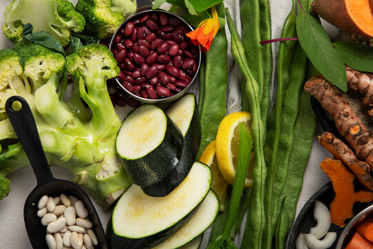 Fresh vegetables, fruits, beans and nuts. Food cooking background.