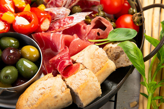 Table full of mediterranean appetizers or antipasto. Assorted Italian food set.