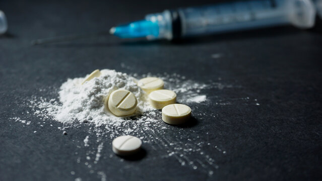 drugs with a disposable syringe. Misused concept of drugs.