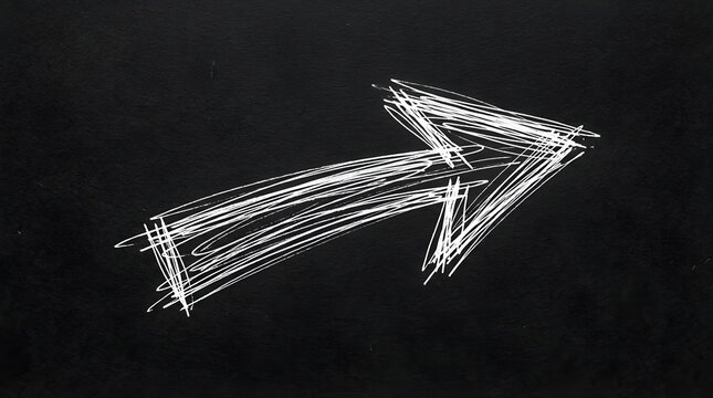 White scribble arrow drawing pointing right on a black chalkboard background