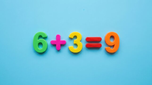 Colorful plastic numbers 6, 3, and 9 with plus and equal signs on a light blue background