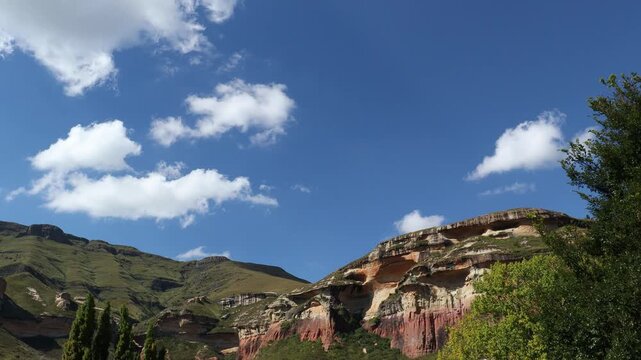 Time lapse of clouds over the scenic sandstone rocks in late afternoon light, Golden Gate National Park, South Africa