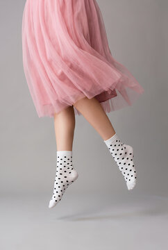 Woman wearing pink tulle skirt polka dots socks fashion
