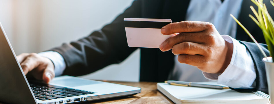 hands of man using mobile smart phone for scan and payment bill online