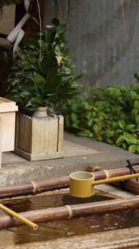 Traditional Bamboo Ladle at a Shinto Shrine Water Basin in Tokyo