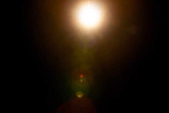 Sun flare on the black background