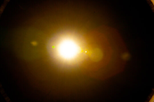Sun flare on the black background