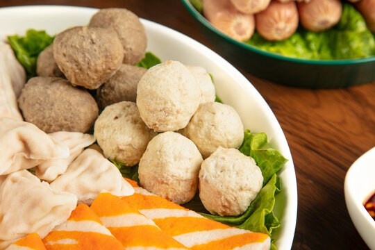 Asian Hot Pot Ingredients Fish Balls Mushroom Balls and Vegetables in Bowls Ready for Cooking